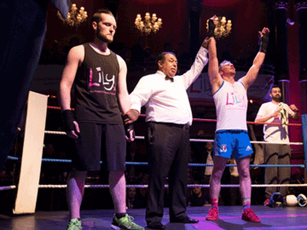 Two boxers in the ring at The Lily Foundation charity boxing event